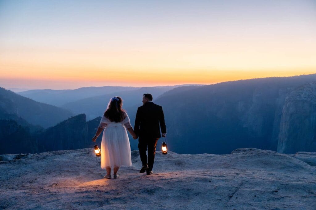 Holding hands while walking along a cliff edge during golden hour